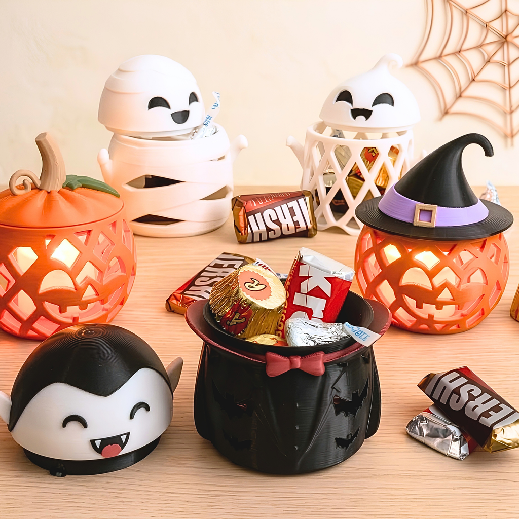 3D printed Halloween candy holders: Jack O'Lantern pumpkin, ghost, witch pumpkin, mummy and vampire with wrapped candy