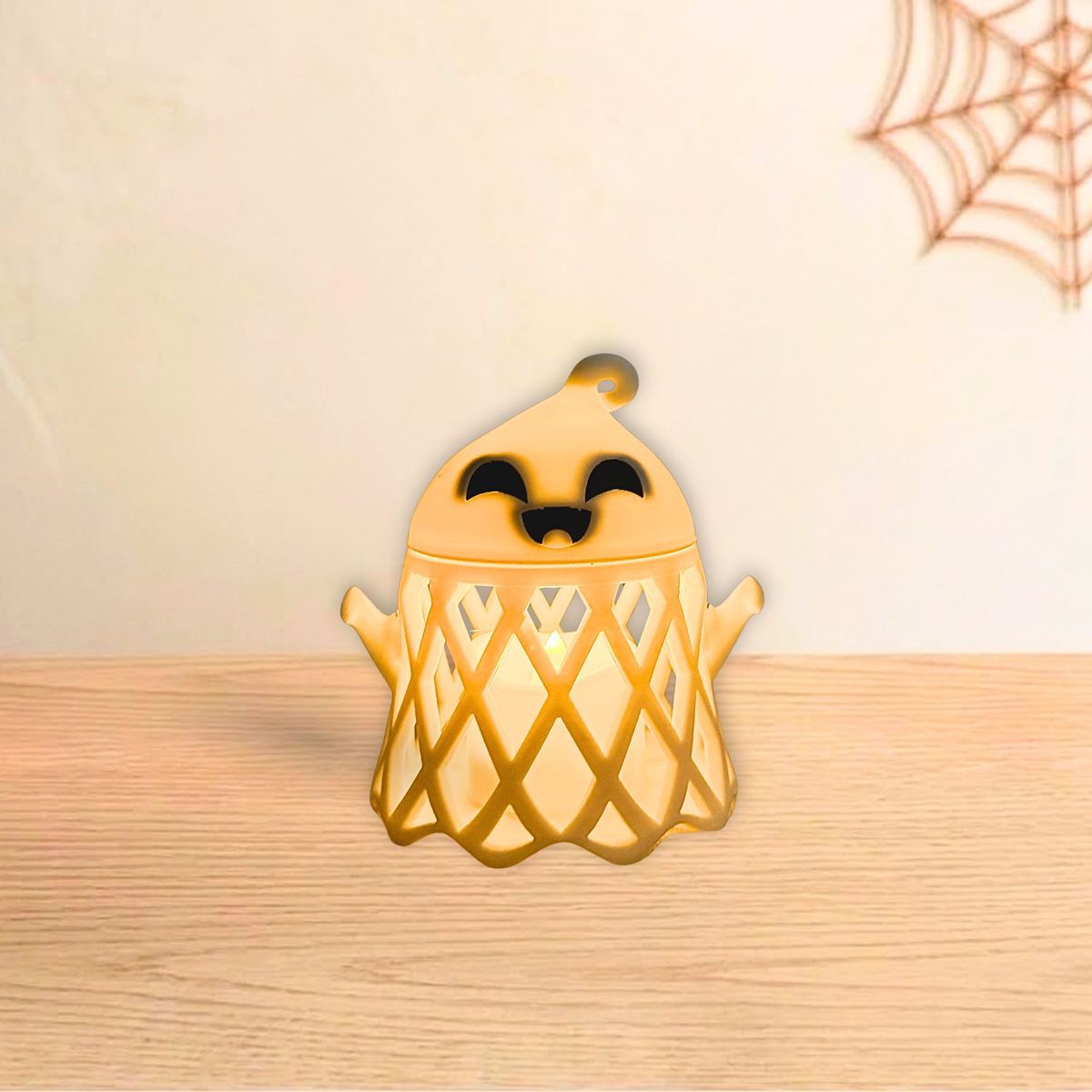 Ghost holder glowing warm with an LED tea light inside