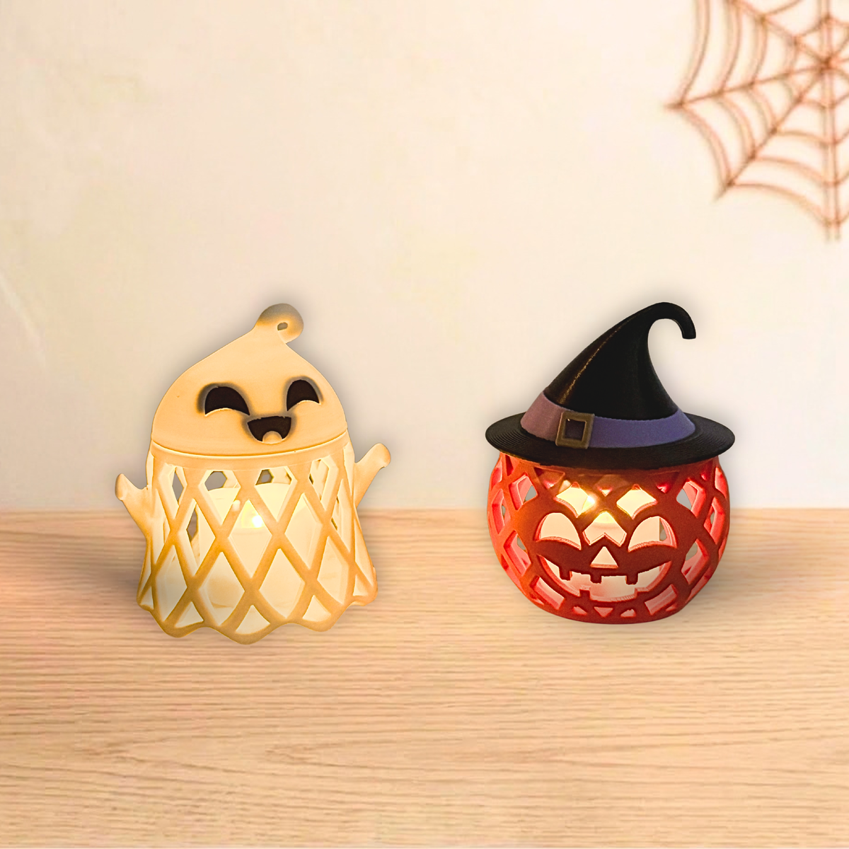 Ghost and Witch Pumpkin holders lit with LED tea lights