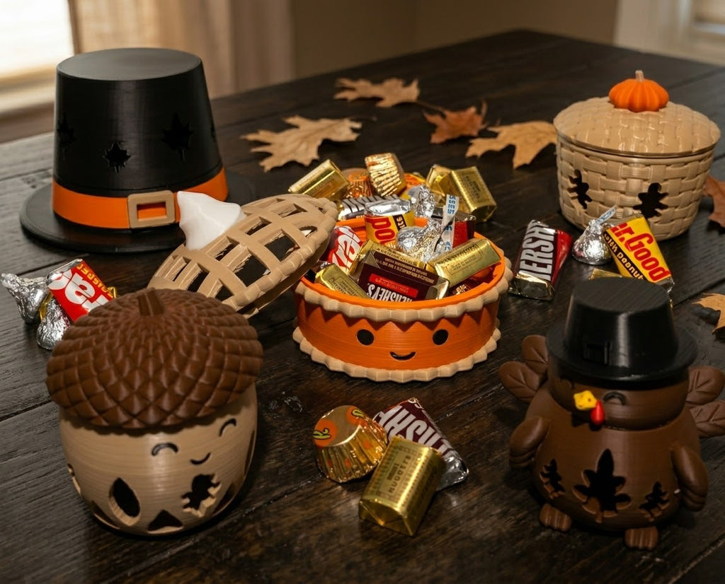 Thanksgiving candy holder set on a dark wood table with fall leaves and wrapped candy