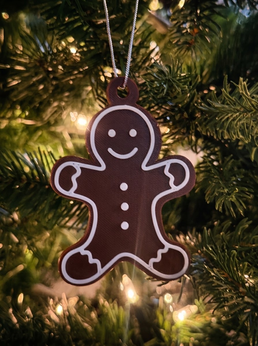 Gingerbread man ornament on a Christmas tree