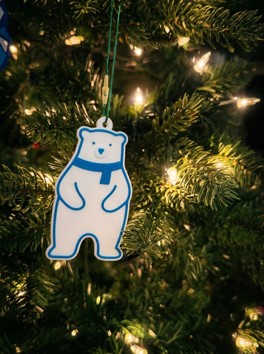 Polar bear ornament with blue scarf