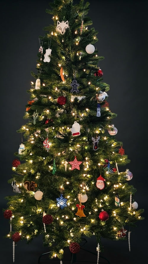Christmas tree decorated with colorful 3D printed ornaments and lights